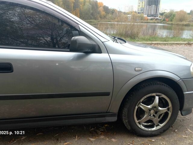 Серый Опель Астра, объемом двигателя 1.4 л и пробегом 212 тыс. км за 4200 $, фото 3 на Automoto.ua