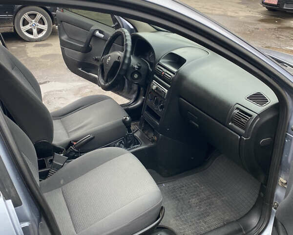 Серый Опель Астра, объемом двигателя 1.4 л и пробегом 283 тыс. км за 3200 $, фото 13 на Automoto.ua