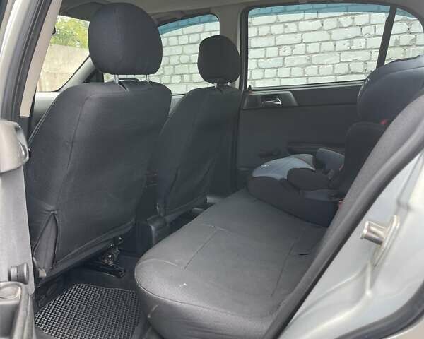 Серый Опель Астра, объемом двигателя 1.4 л и пробегом 172 тыс. км за 3500 $, фото 4 на Automoto.ua