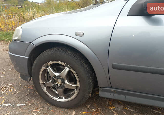 Серый Опель Астра, объемом двигателя 1.4 л и пробегом 212 тыс. км за 3900 $, фото 4 на Automoto.ua