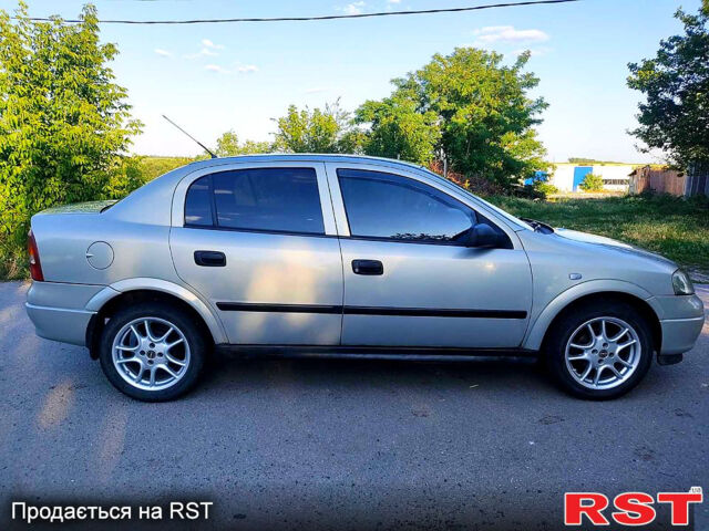 Серый Опель Астра, объемом двигателя 1.4 л и пробегом 198 тыс. км за 3500 $, фото 2 на Automoto.ua