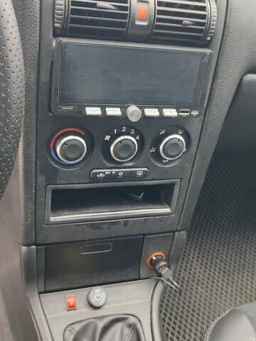 Серый Опель Астра, объемом двигателя 1.4 л и пробегом 156 тыс. км за 4500 $, фото 47 на Automoto.ua