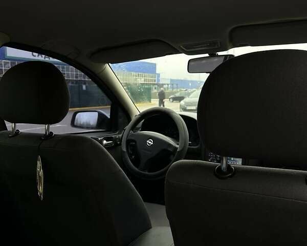 Серый Опель Астра, объемом двигателя 1.4 л и пробегом 185 тыс. км за 4500 $, фото 7 на Automoto.ua