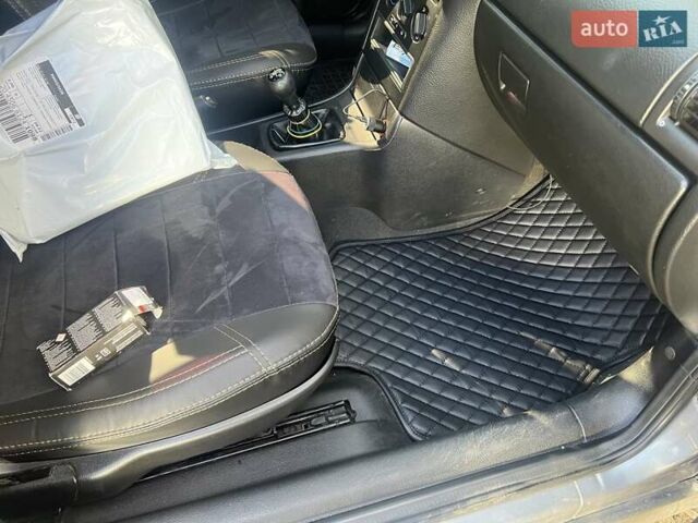 Серый Опель Астра, объемом двигателя 1.4 л и пробегом 173 тыс. км за 5500 $, фото 4 на Automoto.ua