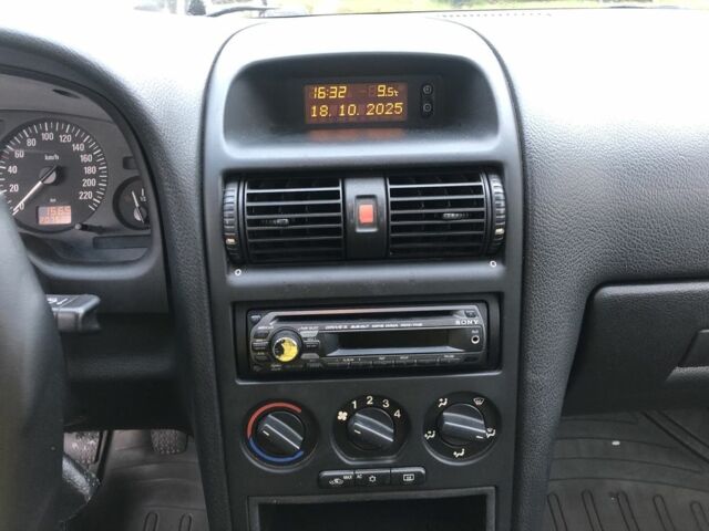 Серый Опель Астра, объемом двигателя 1.4 л и пробегом 207 тыс. км за 3500 $, фото 8 на Automoto.ua