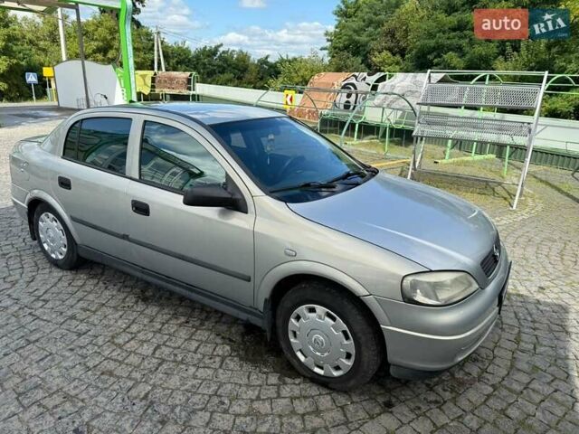 Серый Опель Астра, объемом двигателя 1.4 л и пробегом 211 тыс. км за 3200 $, фото 5 на Automoto.ua