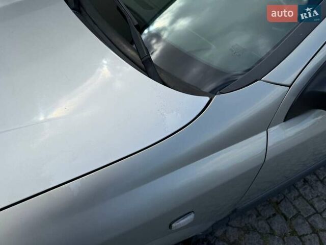 Серый Опель Астра, объемом двигателя 1.4 л и пробегом 211 тыс. км за 3200 $, фото 8 на Automoto.ua