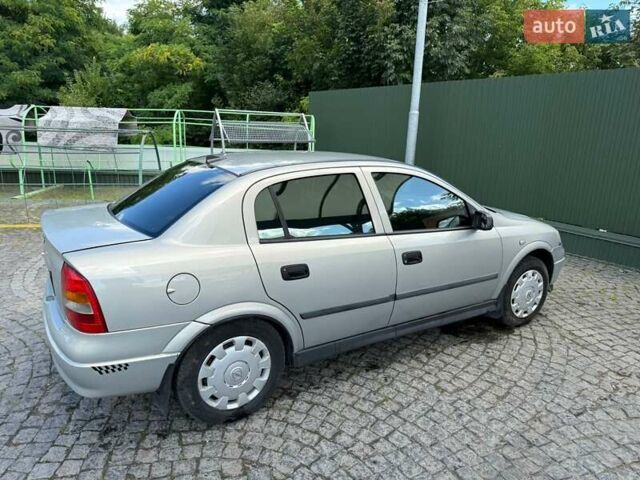 Серый Опель Астра, объемом двигателя 1.4 л и пробегом 211 тыс. км за 3200 $, фото 4 на Automoto.ua