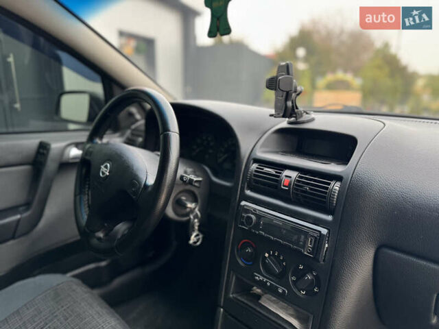 Серый Опель Астра, объемом двигателя 1.4 л и пробегом 188 тыс. км за 3800 $, фото 9 на Automoto.ua