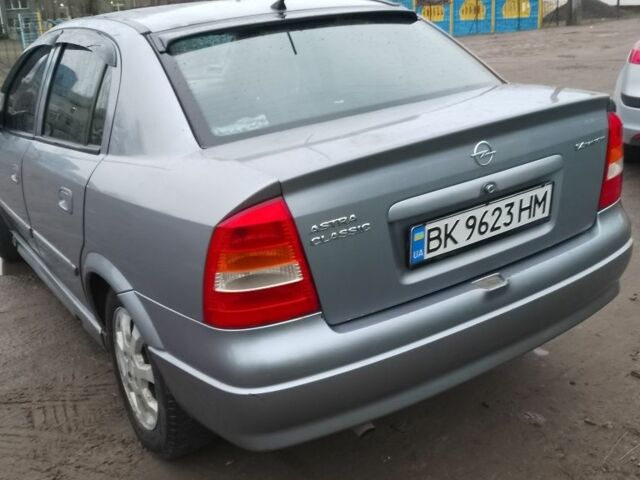 Серый Опель Астра, объемом двигателя 1.4 л и пробегом 290 тыс. км за 2400 $, фото 2 на Automoto.ua