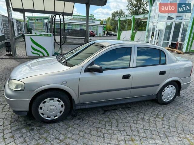 Серый Опель Астра, объемом двигателя 1.4 л и пробегом 211 тыс. км за 3200 $, фото 9 на Automoto.ua