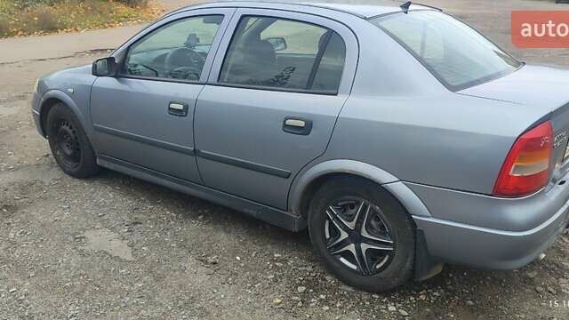 Серый Опель Астра, объемом двигателя 1.4 л и пробегом 250 тыс. км за 3000 $, фото 3 на Automoto.ua