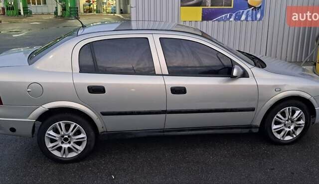 Серый Опель Астра, объемом двигателя 1.39 л и пробегом 202 тыс. км за 3000 $, фото 6 на Automoto.ua