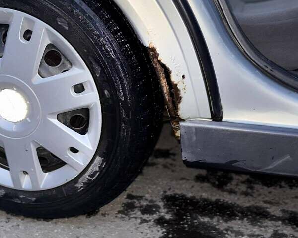 Серый Опель Астра, объемом двигателя 1.4 л и пробегом 140 тыс. км за 4500 $, фото 7 на Automoto.ua