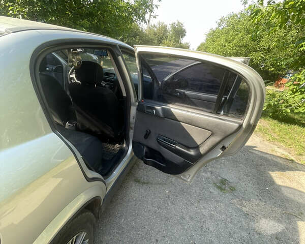 Серый Опель Астра, объемом двигателя 1.6 л и пробегом 176 тыс. км за 4750 $, фото 10 на Automoto.ua