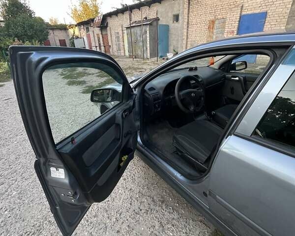 Серый Опель Астра, объемом двигателя 1.4 л и пробегом 228 тыс. км за 4000 $, фото 5 на Automoto.ua