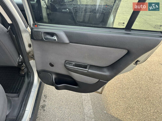 Серый Опель Астра, объемом двигателя 1.4 л и пробегом 200 тыс. км за 4200 $, фото 16 на Automoto.ua