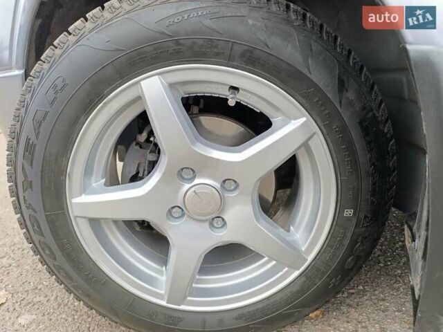 Серый Опель Астра, объемом двигателя 1.4 л и пробегом 77 тыс. км за 4400 $, фото 6 на Automoto.ua