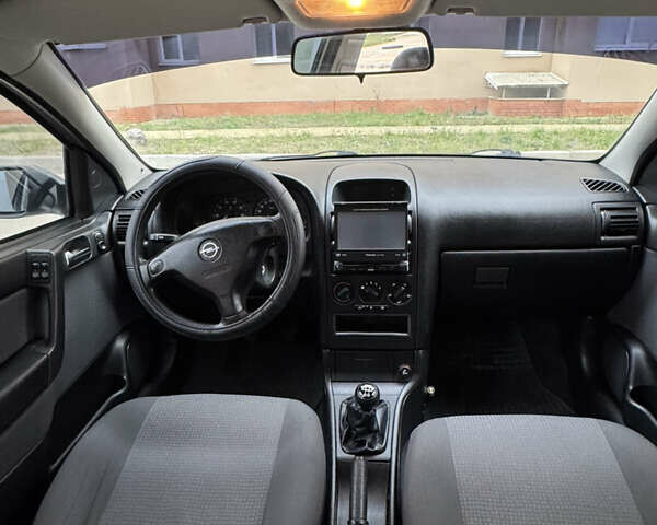 Серый Опель Астра, объемом двигателя 1.6 л и пробегом 113 тыс. км за 5500 $, фото 7 на Automoto.ua