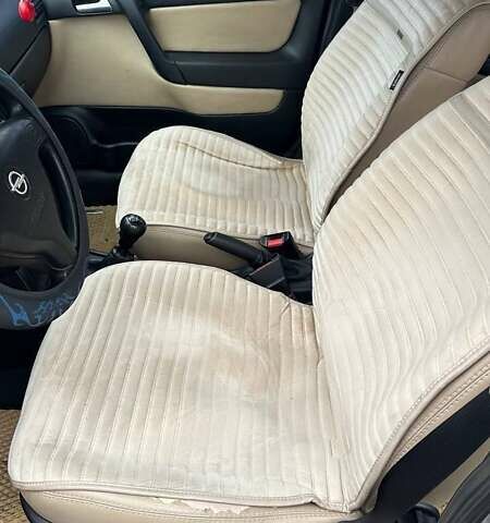 Серый Опель Астра, объемом двигателя 1.6 л и пробегом 179 тыс. км за 4000 $, фото 24 на Automoto.ua