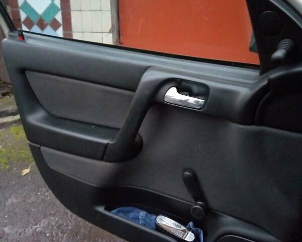 Серый Опель Астра, объемом двигателя 1.4 л и пробегом 119 тыс. км за 5000 $, фото 8 на Automoto.ua