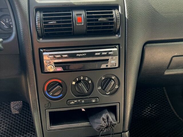 Серый Опель Астра, объемом двигателя 1.4 л и пробегом 326 тыс. км за 4200 $, фото 6 на Automoto.ua