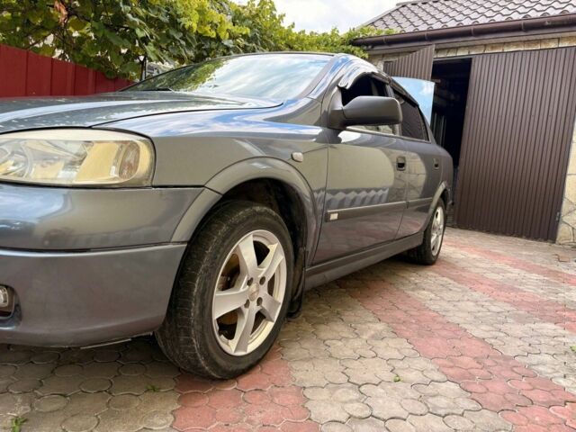 Серый Опель Астра, объемом двигателя 1.4 л и пробегом 201 тыс. км за 3600 $, фото 3 на Automoto.ua