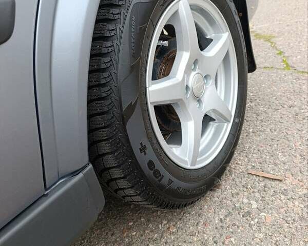 Серый Опель Астра, объемом двигателя 1.4 л и пробегом 77 тыс. км за 4400 $, фото 7 на Automoto.ua