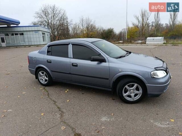 Серый Опель Астра, объемом двигателя 1.4 л и пробегом 77 тыс. км за 4400 $, фото 2 на Automoto.ua