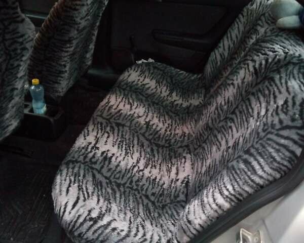 Серый Опель Астра, объемом двигателя 1.4 л и пробегом 119 тыс. км за 5000 $, фото 7 на Automoto.ua