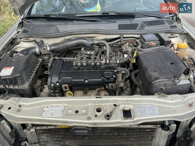 Серый Опель Астра, объемом двигателя 1.4 л и пробегом 326 тыс. км за 4200 $, фото 12 на Automoto.ua