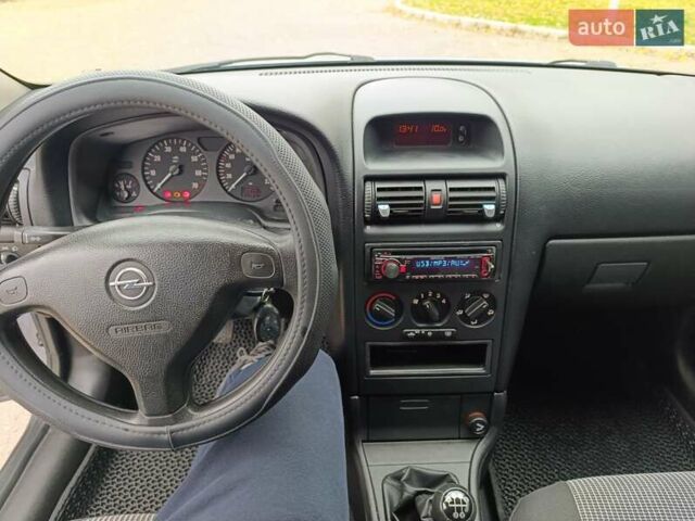 Серый Опель Астра, объемом двигателя 1.4 л и пробегом 77 тыс. км за 4400 $, фото 12 на Automoto.ua