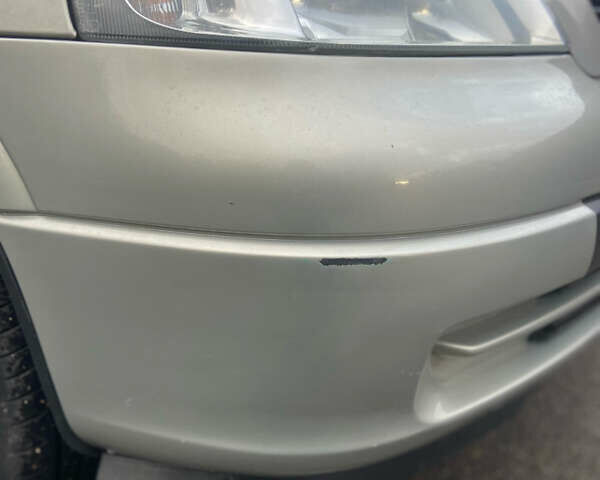 Серый Опель Астра, объемом двигателя 1.4 л и пробегом 104 тыс. км за 3900 $, фото 6 на Automoto.ua