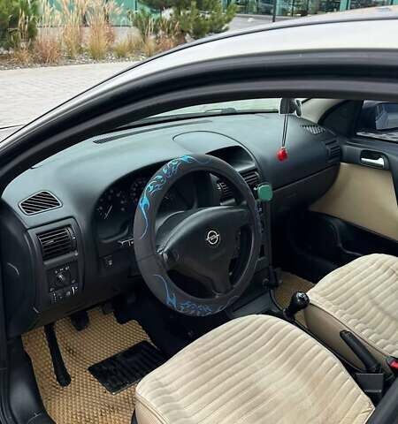 Серый Опель Астра, объемом двигателя 1.6 л и пробегом 179 тыс. км за 4000 $, фото 21 на Automoto.ua