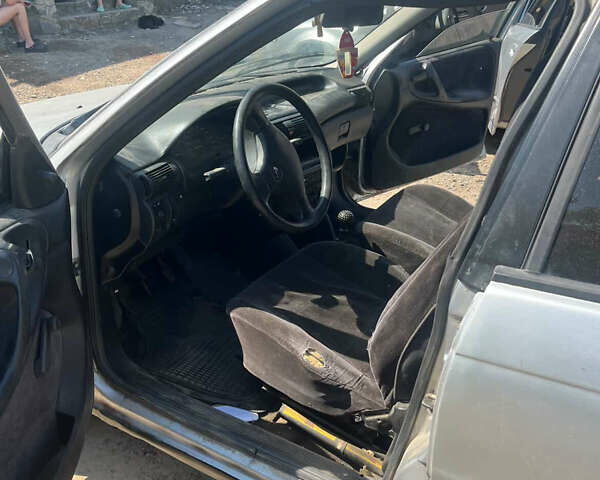 Серый Опель Астра, объемом двигателя 1.6 л и пробегом 100 тыс. км за 1100 $, фото 5 на Automoto.ua