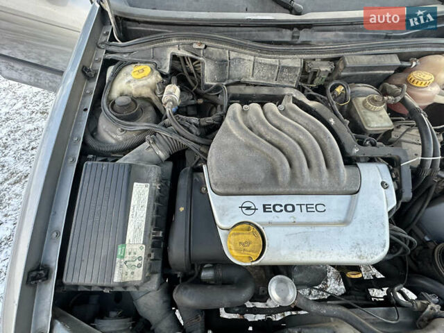 Серый Опель Астра, объемом двигателя 1.6 л и пробегом 295 тыс. км за 2350 $, фото 26 на Automoto.ua