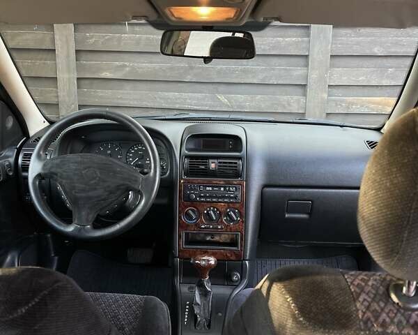 Серый Опель Астра, объемом двигателя 2 л и пробегом 283 тыс. км за 3100 $, фото 11 на Automoto.ua