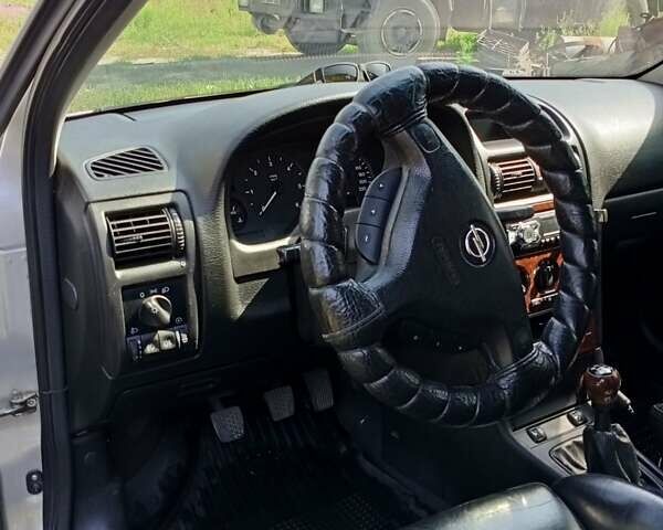 Серый Опель Астра, объемом двигателя 2 л и пробегом 390 тыс. км за 4500 $, фото 10 на Automoto.ua