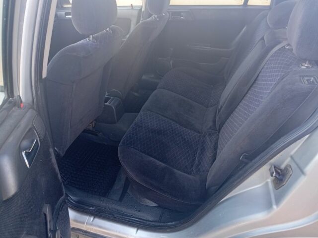 Серый Опель Астра, объемом двигателя 2 л и пробегом 320 тыс. км за 1350 $, фото 5 на Automoto.ua