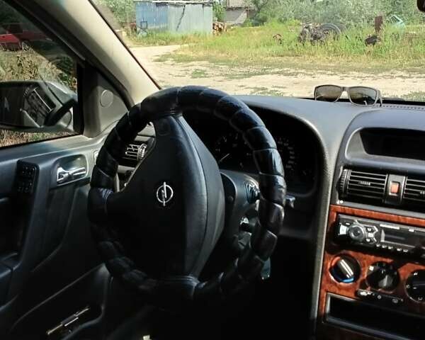 Серый Опель Астра, объемом двигателя 2 л и пробегом 390 тыс. км за 4500 $, фото 22 на Automoto.ua