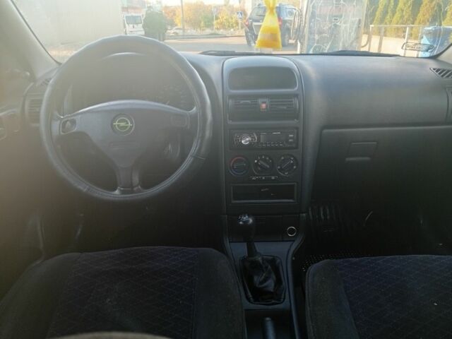 Серый Опель Астра, объемом двигателя 2 л и пробегом 320 тыс. км за 1350 $, фото 3 на Automoto.ua