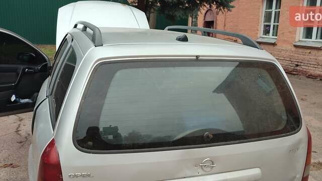 Серый Опель Астра, объемом двигателя 2 л и пробегом 400 тыс. км за 1400 $, фото 3 на Automoto.ua