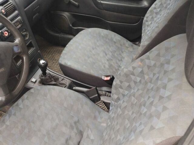 Серый Опель Астра, объемом двигателя 1.4 л и пробегом 250 тыс. км за 2399 $, фото 4 на Automoto.ua