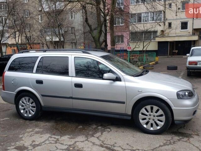 Серый Опель Астра, объемом двигателя 1.4 л и пробегом 322 тыс. км за 4999 $, фото 9 на Automoto.ua