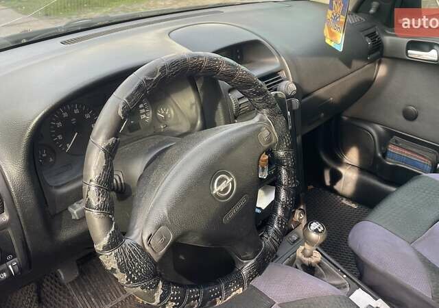 Серый Опель Астра, объемом двигателя 1.6 л и пробегом 190 тыс. км за 3400 $, фото 7 на Automoto.ua