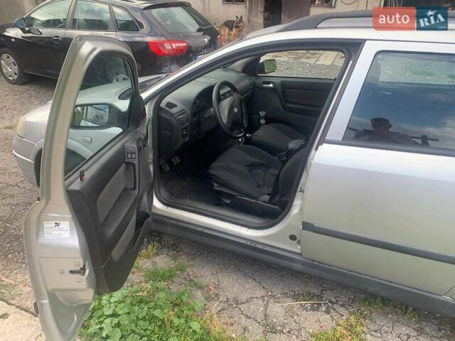 Серый Опель Астра, объемом двигателя 1.6 л и пробегом 242 тыс. км за 3800 $, фото 5 на Automoto.ua