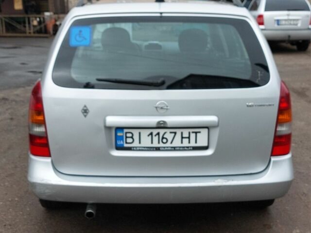 Серый Опель Астра, объемом двигателя 1.6 л и пробегом 296 тыс. км за 2486 $, фото 3 на Automoto.ua