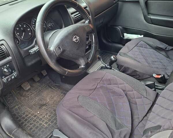 Серый Опель Астра, объемом двигателя 1.69 л и пробегом 310 тыс. км за 3100 $, фото 5 на Automoto.ua