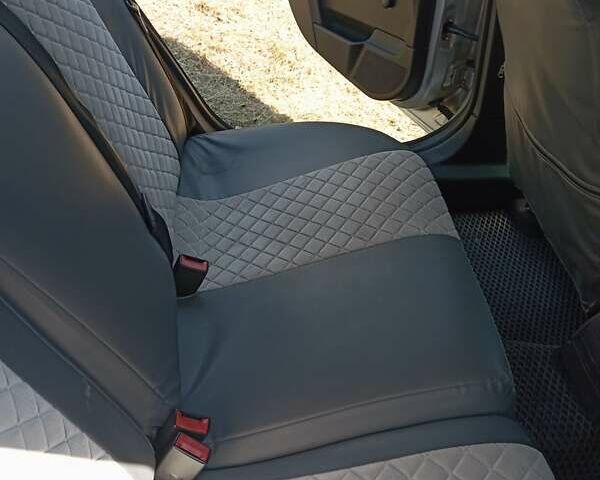 Серый Опель Астра, объемом двигателя 1.7 л и пробегом 296 тыс. км за 5000 $, фото 7 на Automoto.ua