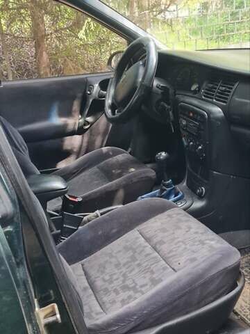 Серый Опель Астра, объемом двигателя 2 л и пробегом 178 тыс. км за 2550 $, фото 8 на Automoto.ua